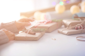 Hands of woman decorating christmas gift box. Hands of woman. Christmas.