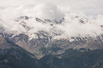 Snowcapped mountains with clouds