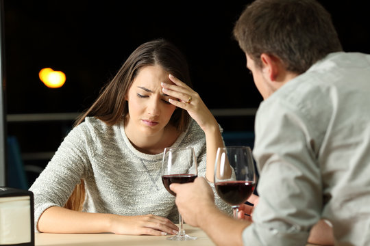 Couple arguing in a restaurant in the night