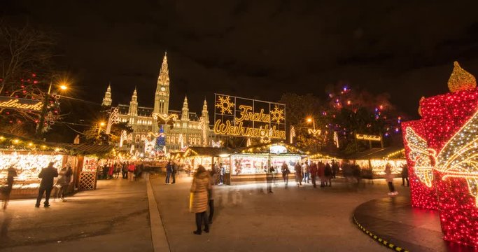 VIENNA, AUSTRIA &ndash; DECEMBER 2015 : Timelapse of christmas market in front of Rathaus / City Hall with Day to Night transition