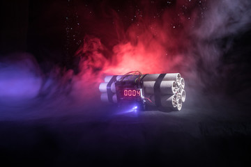Image of a time bomb against dark background. Timer counting down to detonation illuminated in a...