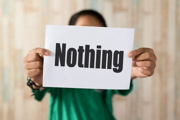 asian boy holding paper note written 