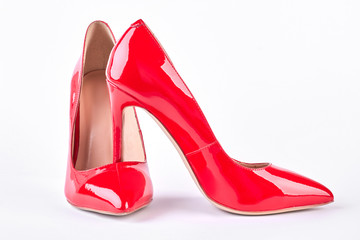 Woman modern red high heels. Pair of red stilettos isolated on white background. Female classic...