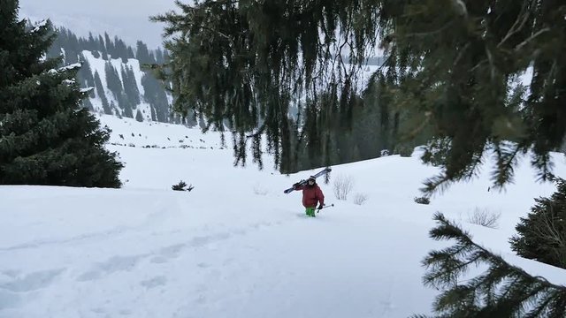 footage of skier hiking at mountain