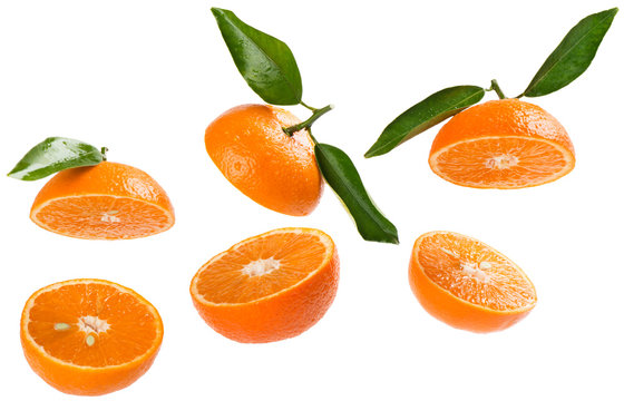   Halves of tangerines in air.