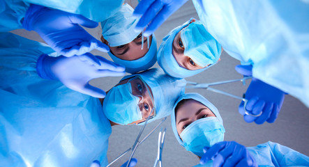Team surgeon at work in operating room