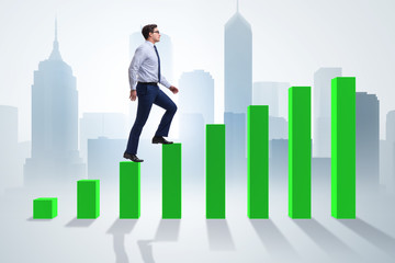 Fototapeta premium Businessman going up the bar chart in growth concept