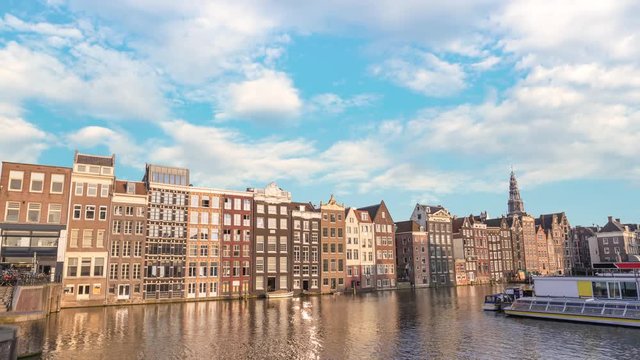 Amsterdam city skyline timelapse at Damrak canal waterfront, Amsterdam, Netherlands 4K Time Lapse