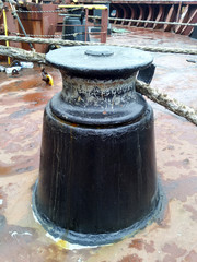 Mooring bollard on the decks of an industrial seaport