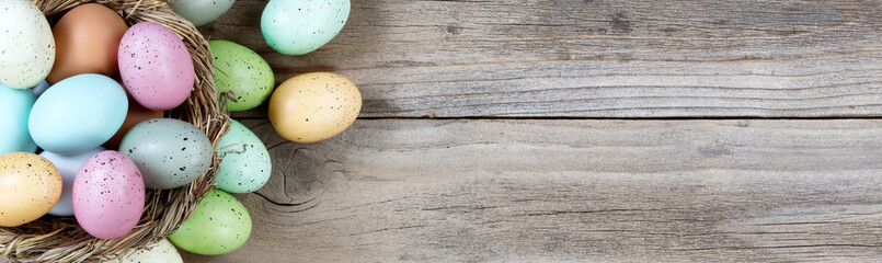 Easter eggs on rustic wooden background for holiday concept  - 187271336