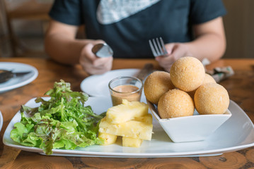 fried cheese balls on white plate
