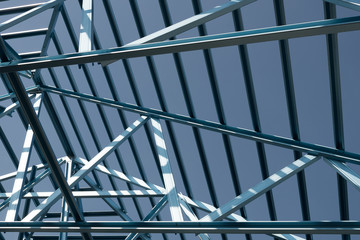 Naklejka premium Structure of steel roof frame for building construction.
