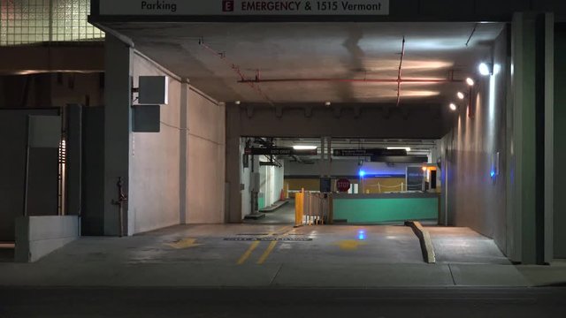 Establishment shot of a car in a parking garage
