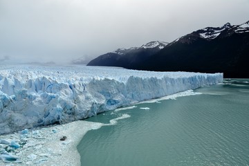Ice wall of the Perito Moreno glacier as it ends in Argentino Lake. It's located in the Los Glaciares National Park and is one of the most important tourist attractions in the Argentinian Patagonia.