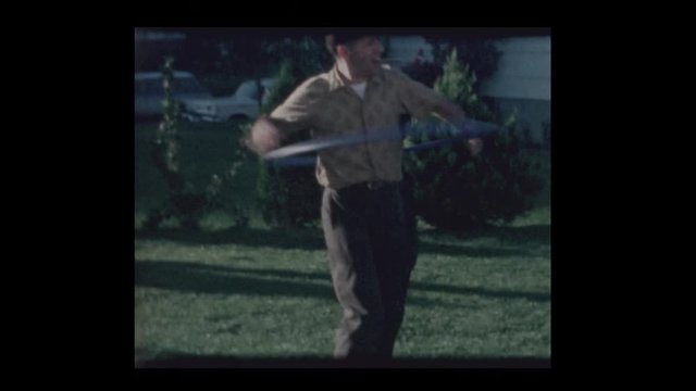 1964 Father plays with Hula Hoop