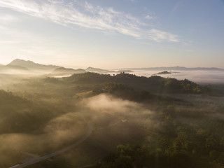 Mountains and trees with beautiful clouds and sky in sunrise,Landscape nature with aerial camera shot,Kanchanaburi Thailand.