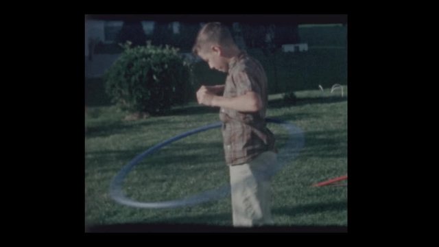 1964 Boy plays with Hula Hoop