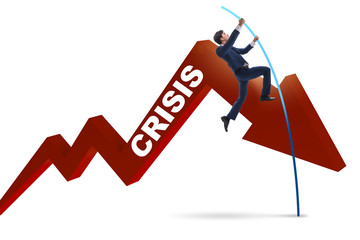 Businessman pole vaulting over crisis in business concept
