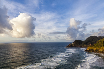 Puffy clouds over the Oregon coast at the Heceta Head Lighthouse
