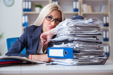 Busy businesswoman working in office at desk