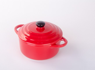 pot or red pot with cover on background.