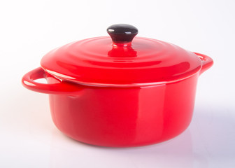 pot or red pot with cover on background.
