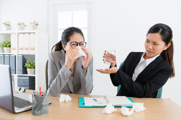 female business woman sneezing during conference