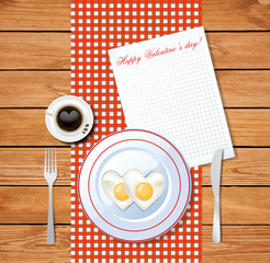  heart shaped fried eggs on white plate and cup of coffee with heart