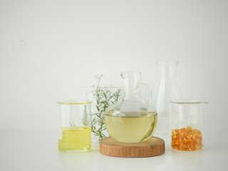 natural cosmetic skincare serum packaging with leaf, home made oil and beauty vitamin ingredient.organic product research the blank bottle container ,bio science . alternative medicine. spa.