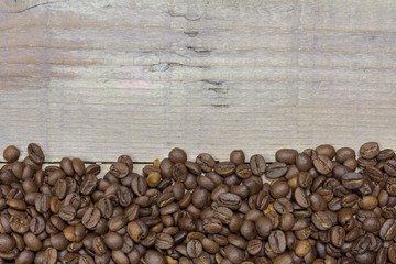 Coffee beans on wooden table. Coffee background