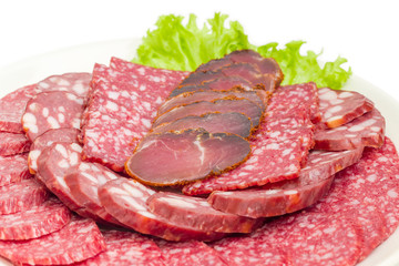 Sliced different salami and other meat products closeup
