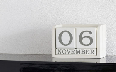 White block calendar present date 6 and month November