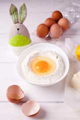 easter cooking still life with elements of cooking Easter cake and eggs, vertical photo