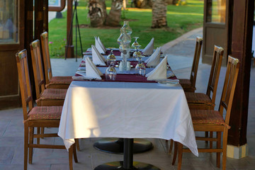 A table served for six people. In the summer cafe.