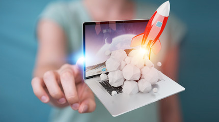 Businesswoman with rocket launching from a laptop 3D rendering