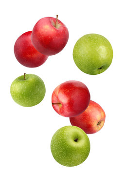 Falling red and green apples isolated on white.