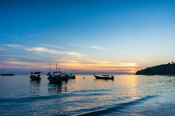 Fishing boat and sunset sky on Pattaya beach, Koh Lipe, Satoon province, Thailand.