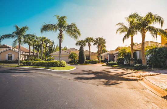 Typical gated community houses with palms, South Florida. Light effect applied