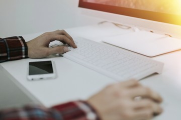 hand closeup with computer on desktop