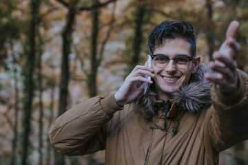 young with outdoor mobile phone