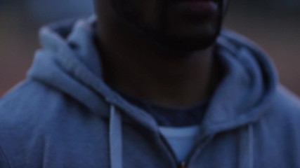 Male jogger getting ready to go for a jog in the cold morning