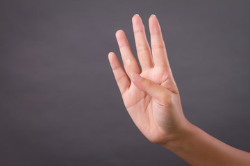 hand pointing up 4 fingers, studio isolated