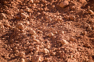 Red clay soil on nature as a background