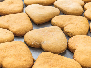 Homemade ginger biscuits in the shape of a heart