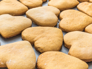 Homemade ginger biscuits in the shape of a heart