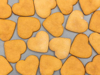 Homemade ginger biscuits in the shape of a heart. The view from the top. Background