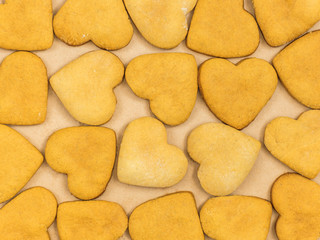 Homemade ginger biscuits in the shape of a heart. The view from the top. Background