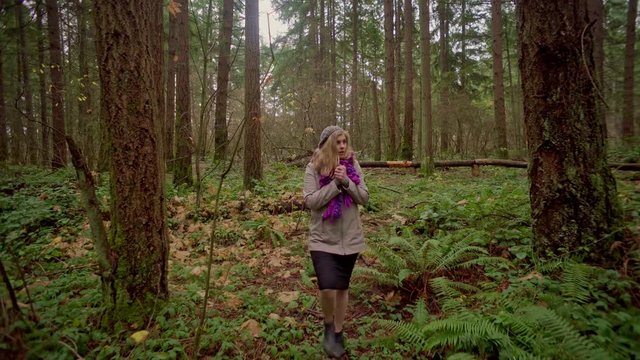 angry blonde woman lost in woods