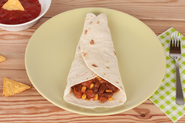 Chili Con Carne on tortilla wrap with salsa sauce and tortilla chips