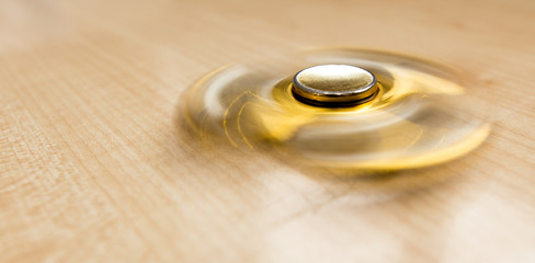 The golden spinner is spinning on the table